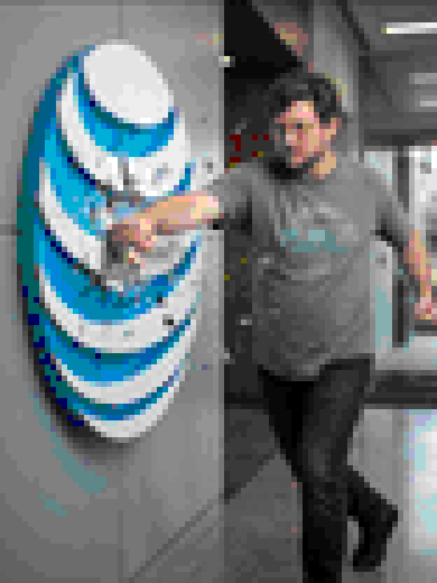 Rixon punching the AT&T logo, rendered in sixteen-color ANSI block art.
